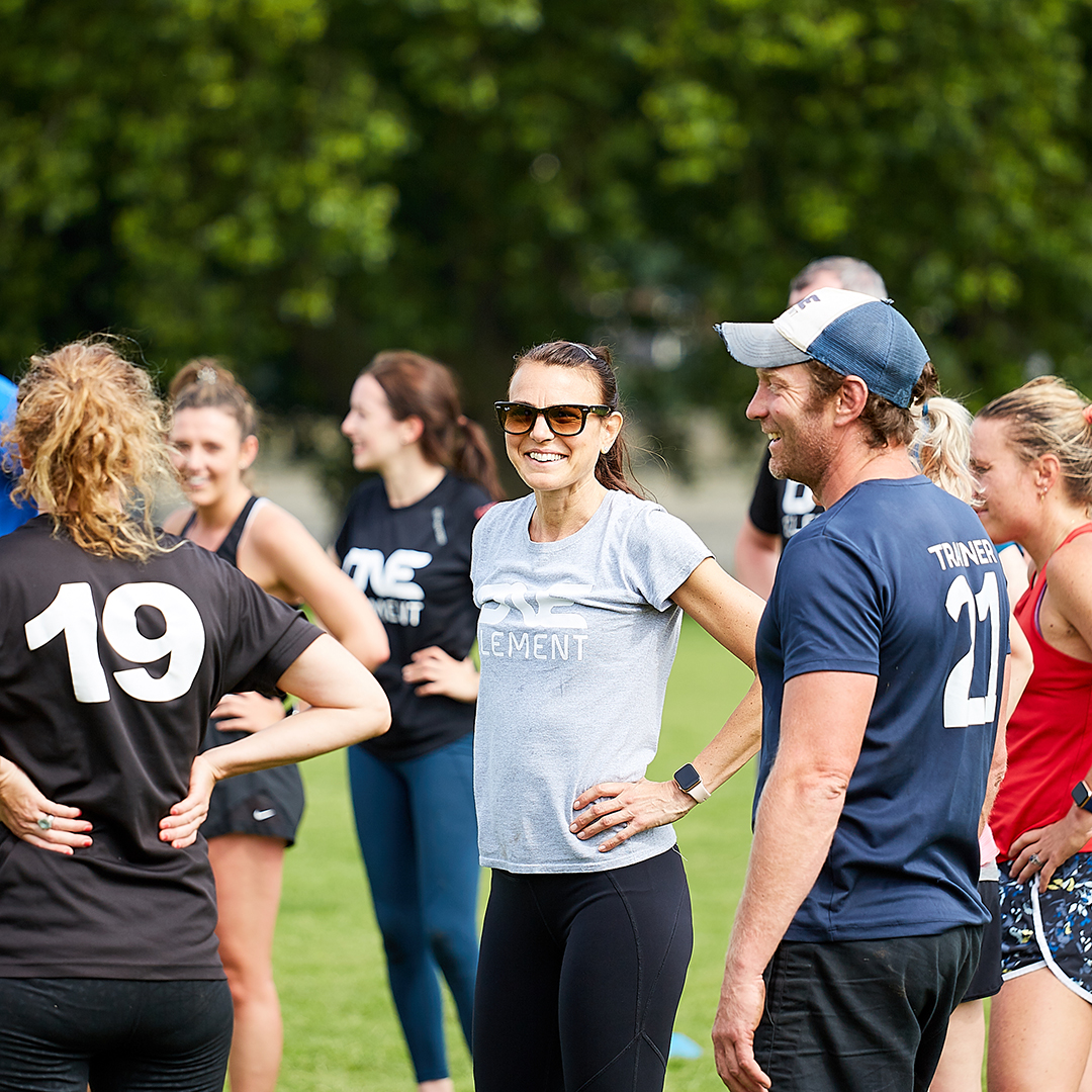 One Element members forming connection through group exercise.