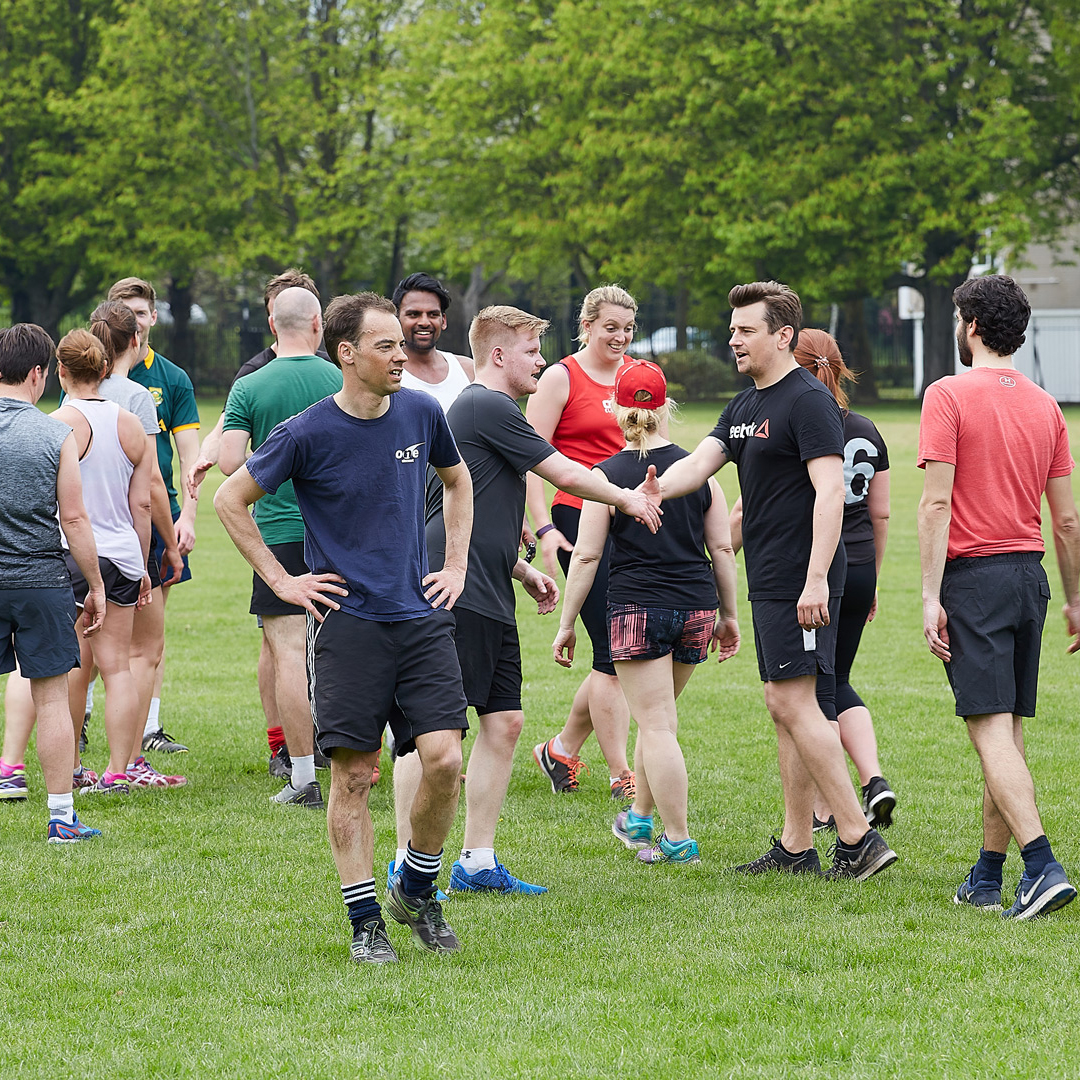 One Element members forming connection through group exercise.