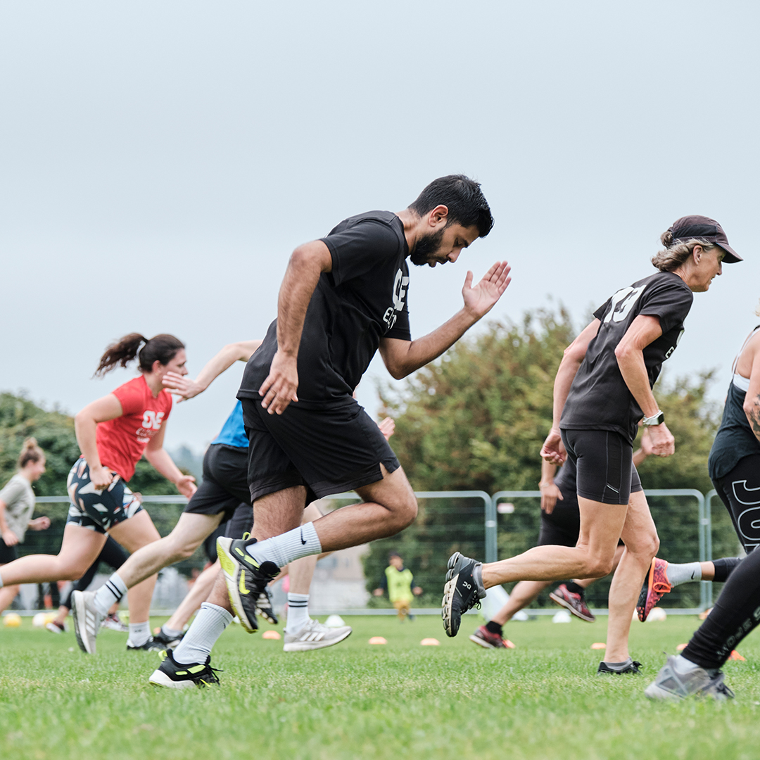 One Element members forming connection through group exercise.