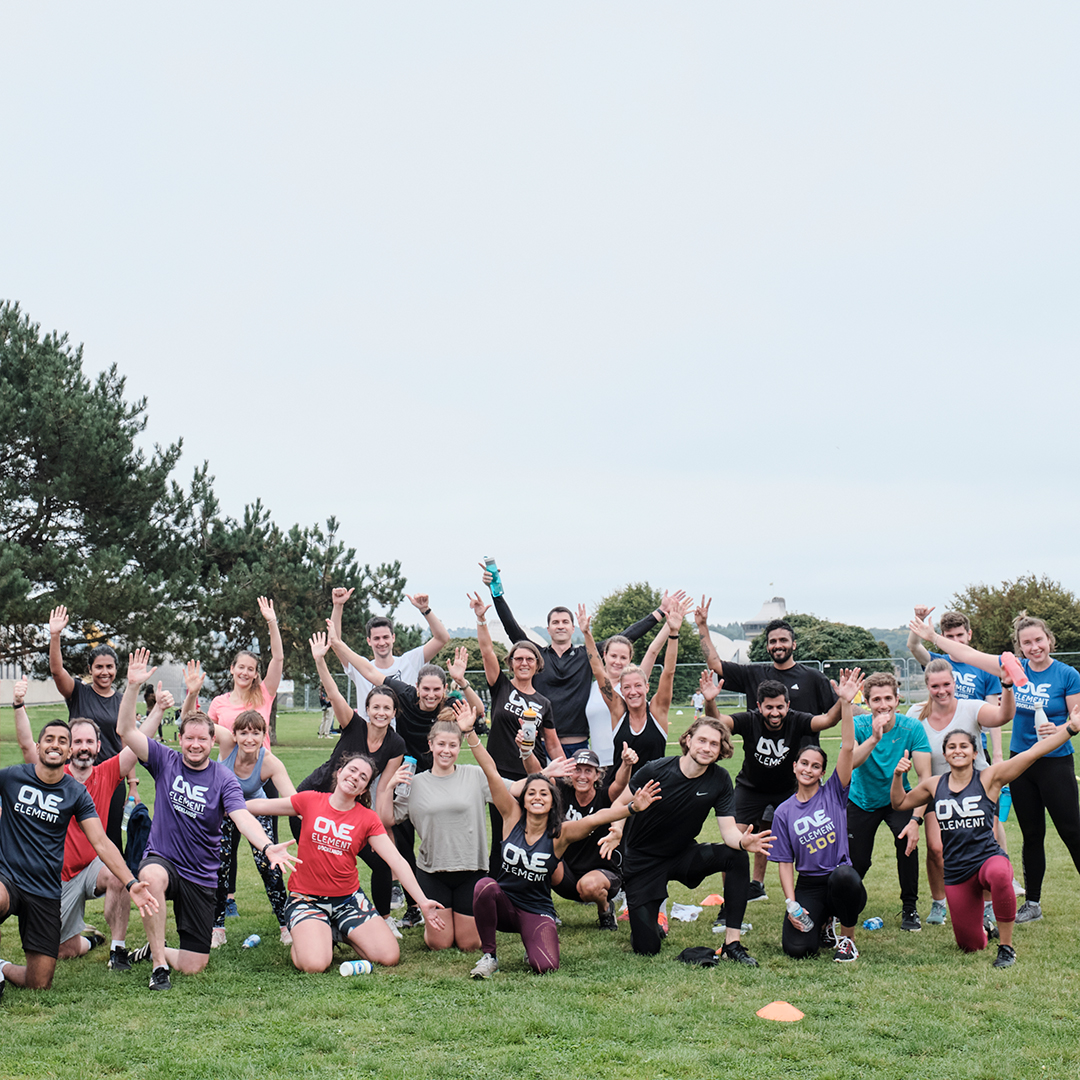 One Element members forming connection through group exercise.