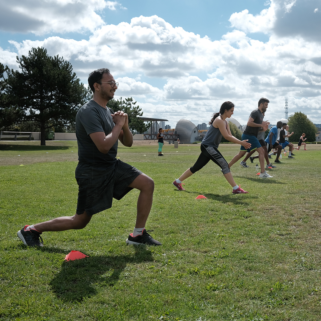 One Element members forming connection through group exercise.